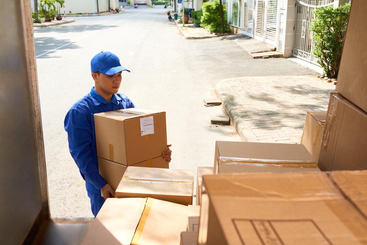 Man Arranging Delivery Boxes